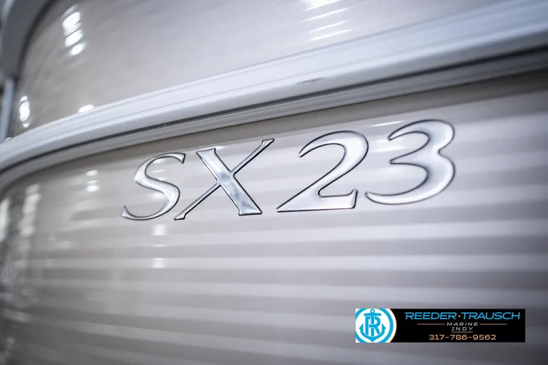 Slide: The Image of 2018 Bennington 23 SSRX boat with SX 23 emblem, Reeder Trausch Marine logo visible. - 53