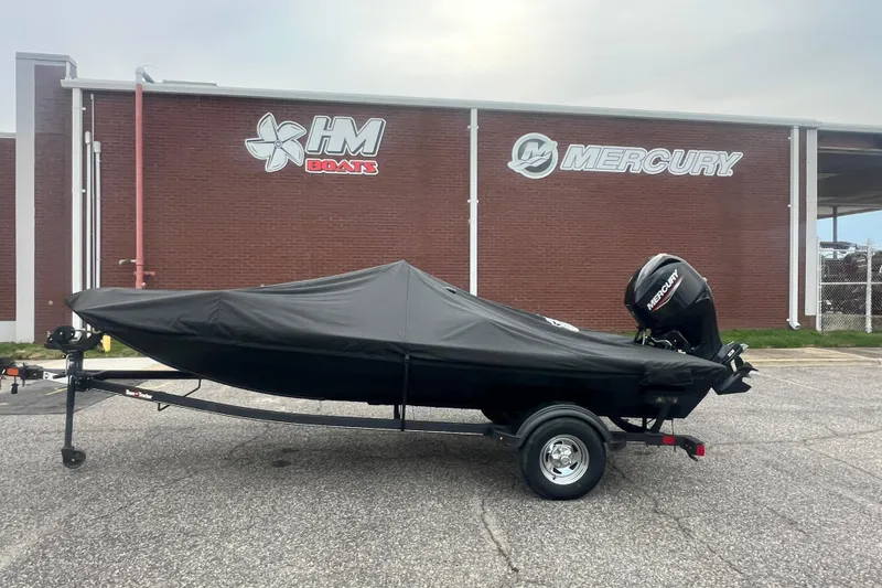 The Image of 2023 Tracker Bass Tracker Classic XL boat covered, parked outside HM Boats and Mercury building. - 0