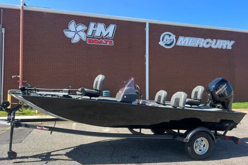Slide: The Image of 2023 Tracker Bass Tracker Classic XL boat on trailer, parked outside HM Boats and Mercury building. - 51