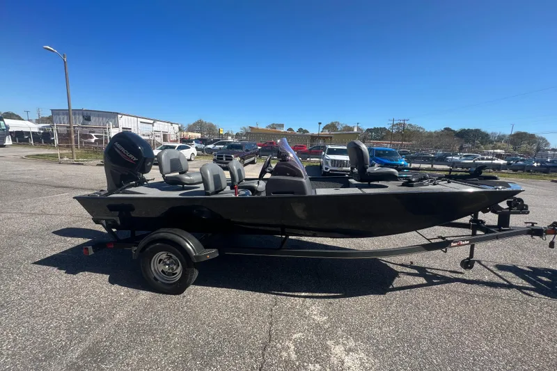 Slide: The Image of 2023 Tracker Bass Tracker Classic XL boat on trailer in parking lot. - 60