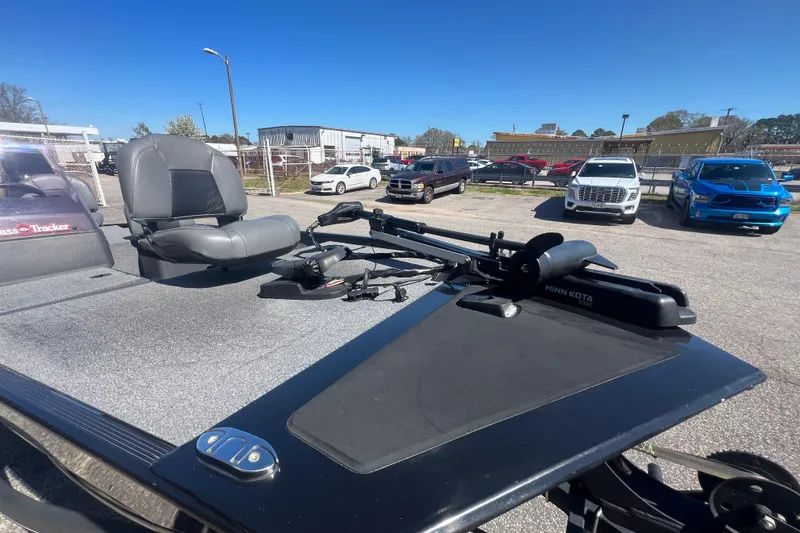Slide: The Image of 2023 Tracker Bass Tracker Classic XL boat with Minn Kota trolling motor in parking lot. - 64