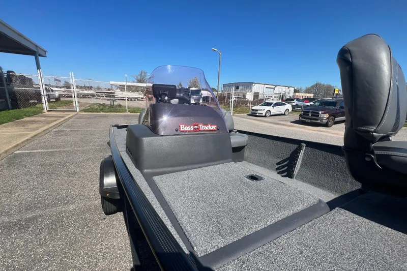 Slide: The Image of 2023 Tracker Bass Tracker Classic XL boat in parking lot, sunny day. - 66