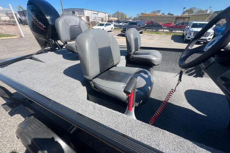 Slide: The Image of 2023 Tracker Bass Tracker Classic XL boat interior with gray seating and Mercury engine. - 67