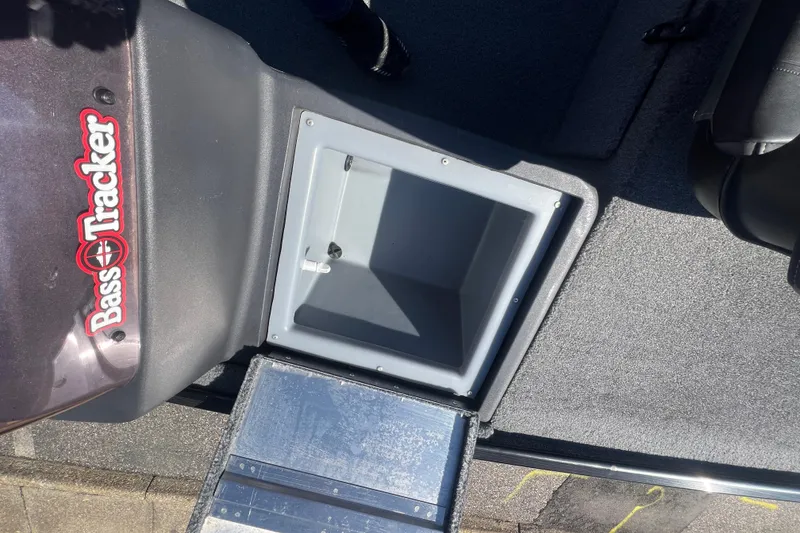 Slide: The Image of 2023 Tracker Bass Tracker Classic XL boat interior with storage compartment open. - 72