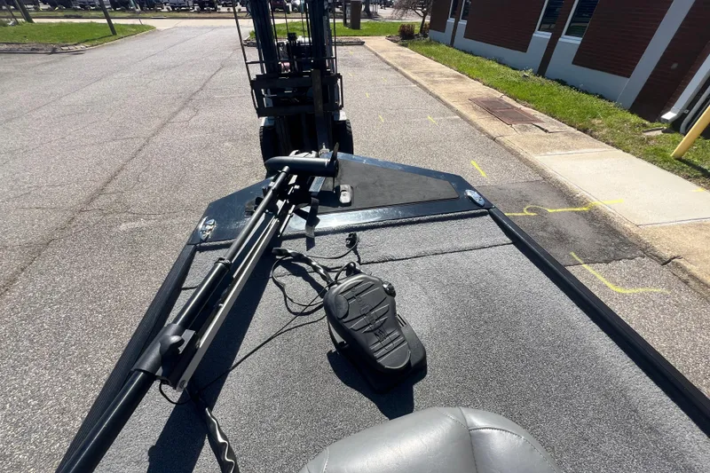 Slide: The Image of 2023 Tracker Bass Tracker Classic XL boat deck with trolling motor on urban street. - 74