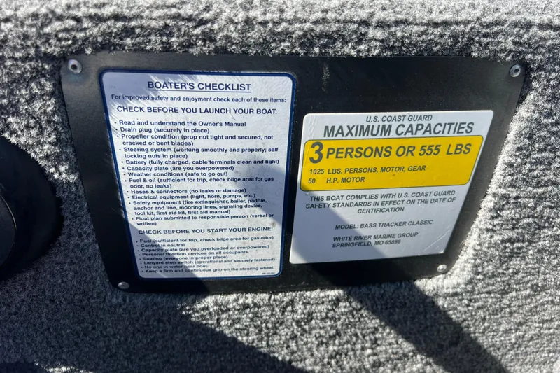 Slide: The Image of 2023 Tracker Bass Tracker Classic XL boat capacity and safety checklist labels. - 79