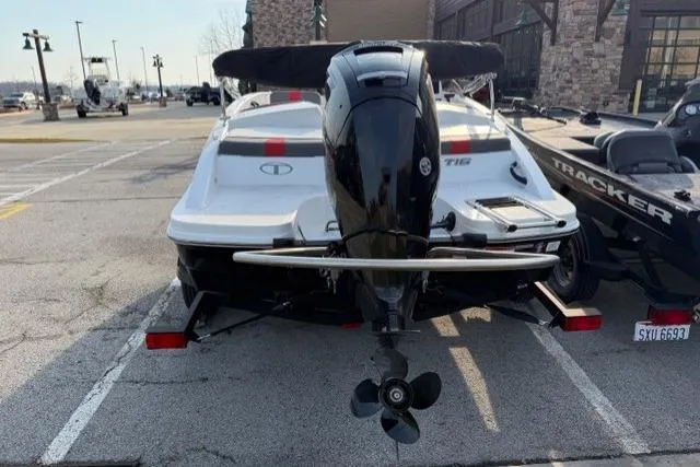 Slide: The Image of 2024 Tahoe T16 boat with outboard motor parked in a lot. - 3