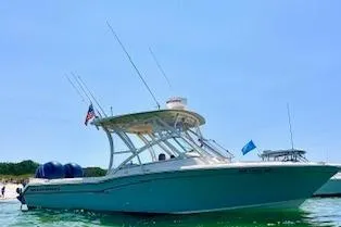 The Image of 2017 Grady-White Freedom 255 boat on water, clear sky background. - 0