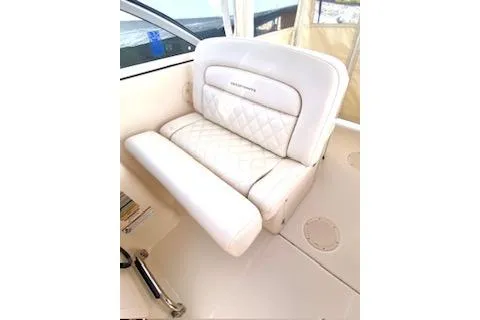 Slide: The Image of 2017 Grady-White Freedom 255 boat seat with quilted white upholstery. - 14