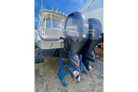 Slide: The Image of 2017 Grady-White Freedom 255 boat with twin Yamaha outboard engines on stands. - 3
