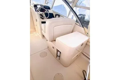 Slide: The Image of 2017 Grady-White Freedom 255 boat interior with helm and seating area. - 9
