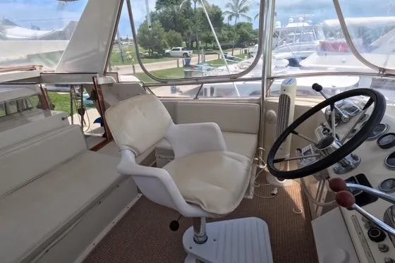 Slide: The Image of 1987 Californian 45 Motor Yacht helm with steering wheel and captain's chair. - 20