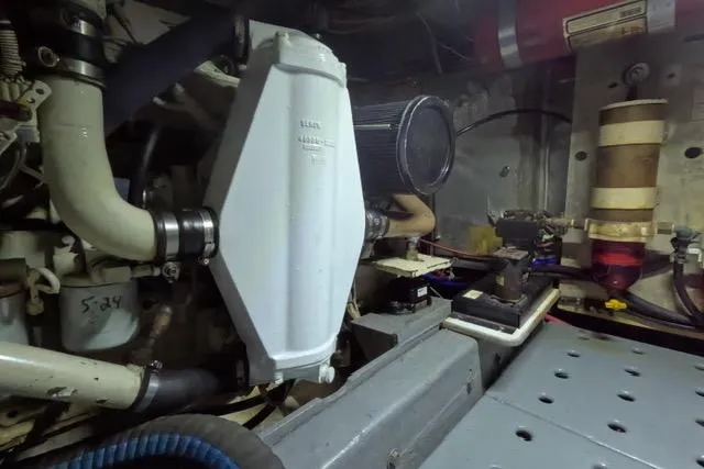 Slide: The Image of Engine room of 1987 Californian 45 Motor Yacht, showcasing mechanical components and systems. - 26