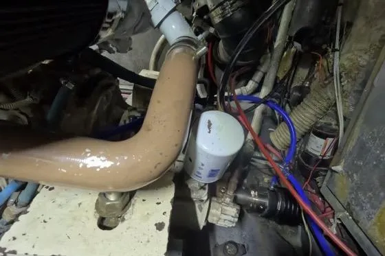 Slide: The Image of Engine compartment of a 1987 Californian 45 Motor Yacht with visible components and wiring. - 28