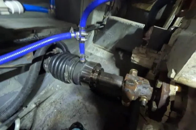 Slide: The Image of Engine compartment of 1987 Californian 45 Motor Yacht with visible hoses and fittings. - 29