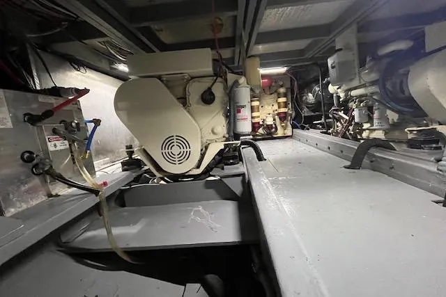 Slide: The Image of Engine room of 1987 Californian 45 Motor Yacht, showcasing mechanical components and systems. - 32