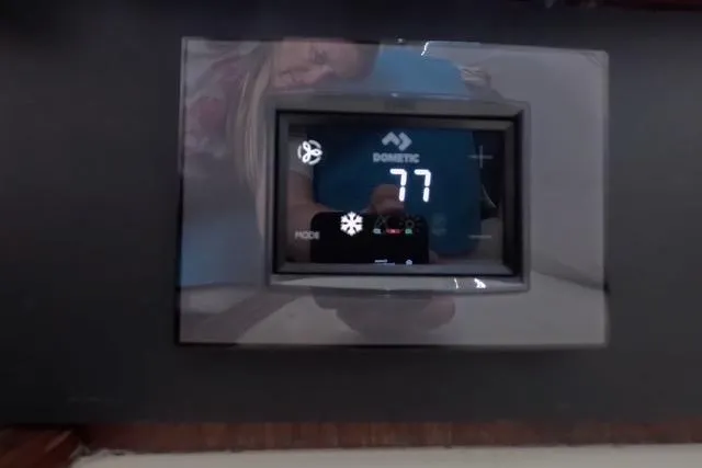 Slide: The Image of Digital thermostat display on 1987 Californian 45 Motor Yacht showing 77 degrees. - 51