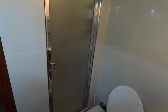 Slide: The Image of Bathroom interior of 1987 Californian 45 Motor Yacht with shower and toilet. - 54