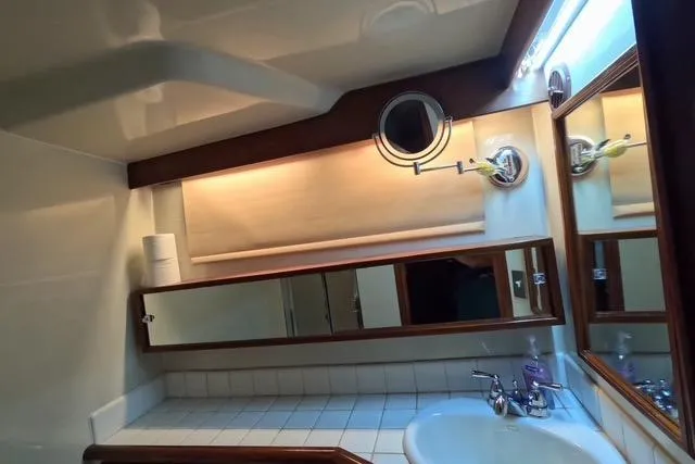 Slide: The Image of Bathroom interior of 1987 Californian 45 Motor Yacht with mirror and sink. - 55