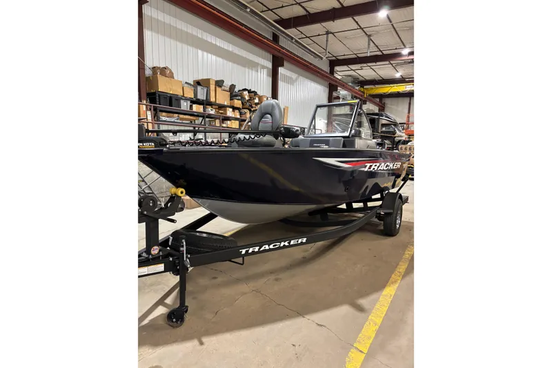 The Image of 2026 Tracker Pro Guide V-175 Combo boat in warehouse setting. - 0