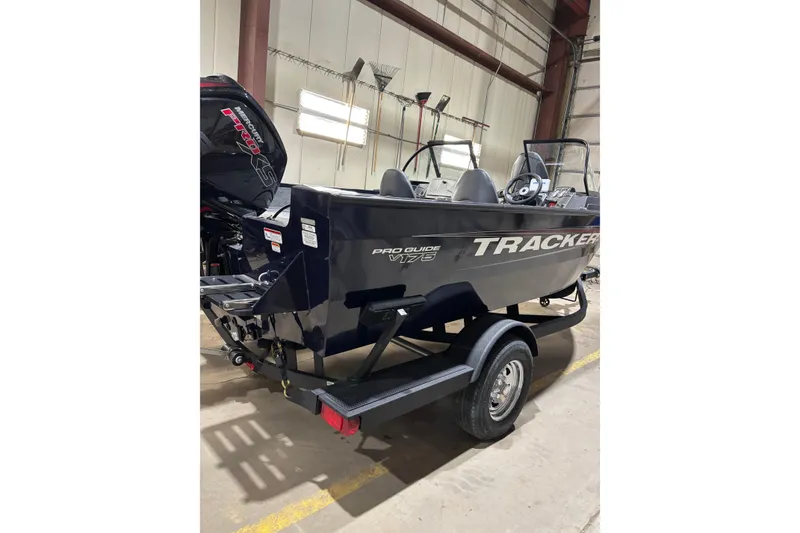 Slide: The Image of 2026 Tracker Pro Guide V-175 Combo boat in a warehouse setting. - 3