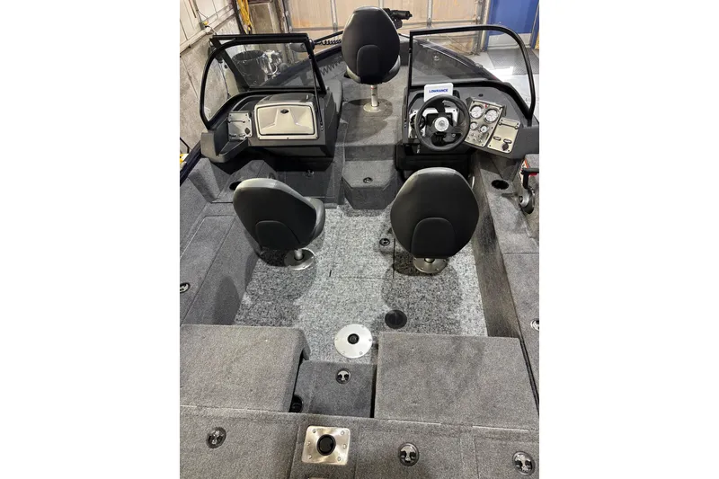 Slide: The Image of 2026 Tracker Pro Guide V-175 Combo boat interior with seating and control panel. - 4