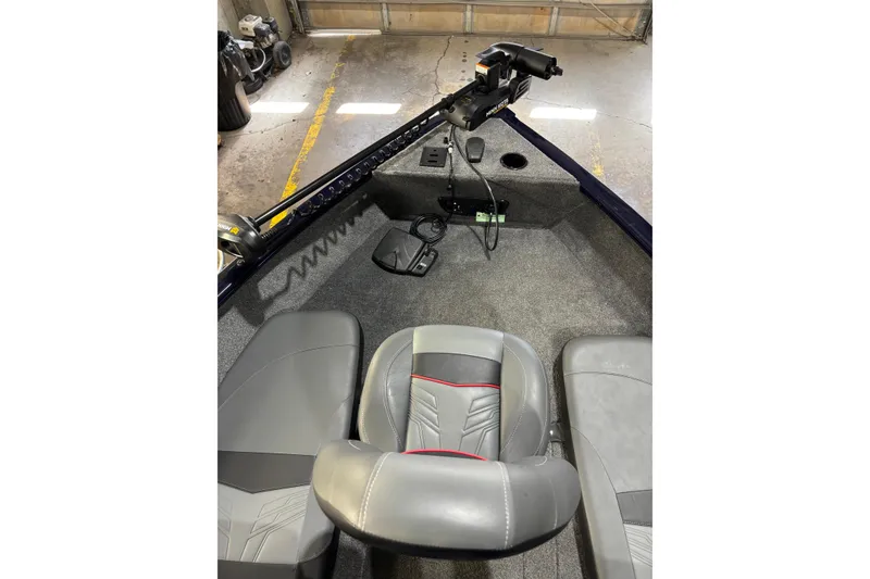 Slide: The Image of Interior of 2026 Tracker Pro Guide V-175 Combo boat with seating and controls. - 5