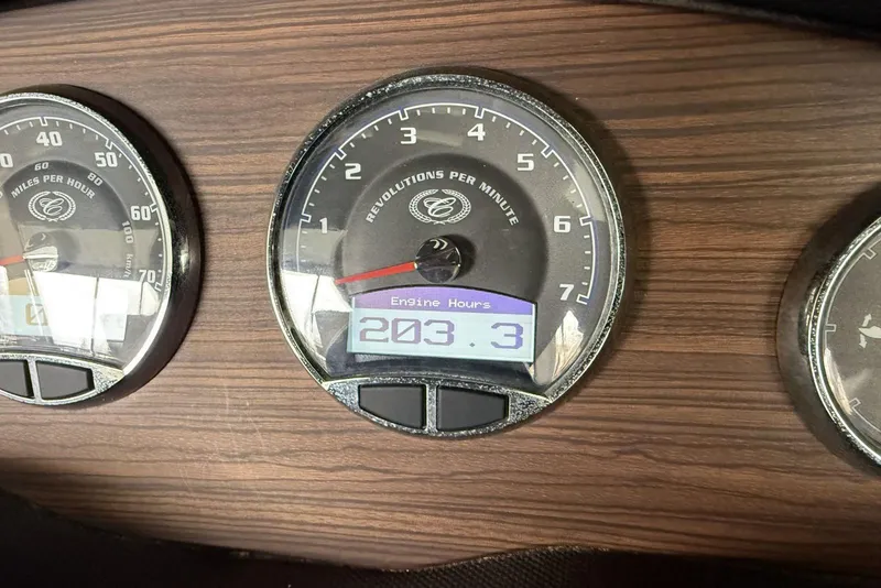 Slide: The Image of Dashboard of a 2014 Cobalt R5 showing 203.3 engine hours. - 10