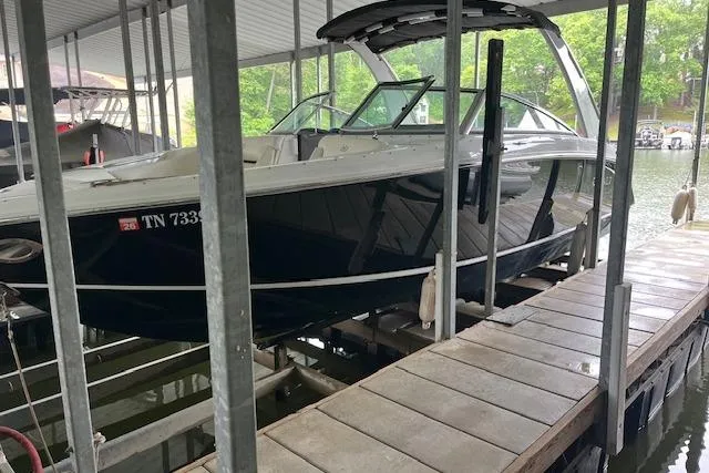 Slide: The Image of 2014 Cobalt R5 boat docked in covered marina slip. - 12