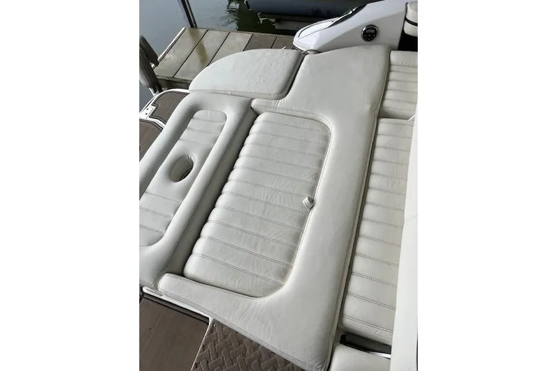 Slide: The Image of White leather seating on a 2014 Cobalt R5 boat, dockside view. - 15