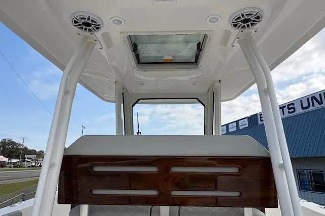 Slide: The Image of 2025 Pursuit S 288 Sport boat interior with speakers and skylight. - 10