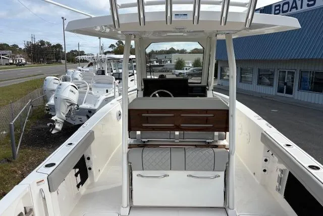 Slide: The Image of 2025 Pursuit S 288 Sport boat interior with helm and seating area. - 3