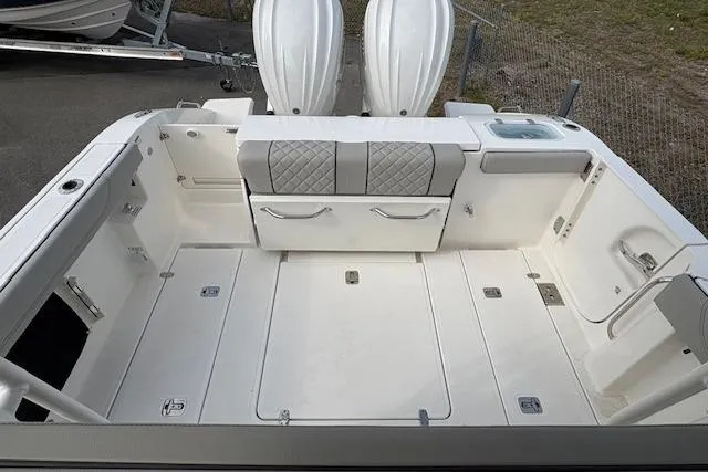 Slide: The Image of 2025 Pursuit S 288 Sport boat deck with seating and storage compartments. - 4
