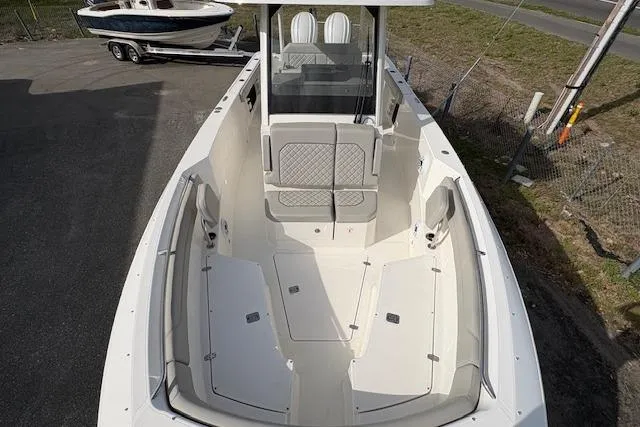 Slide: The Image of 2025 Pursuit S 288 Sport boat with spacious deck and seating area. - 6