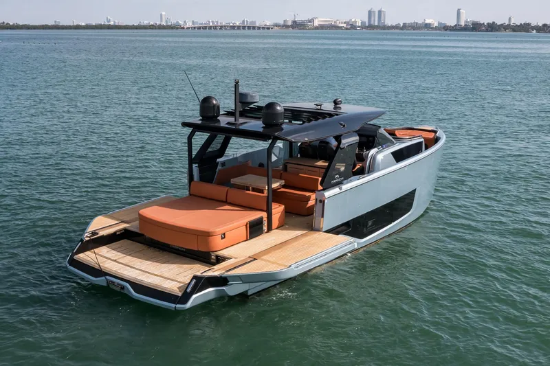 The Image of 2022 Cranchi A46 Luxury Tender on calm water, showcasing sleek design and spacious deck. - 1