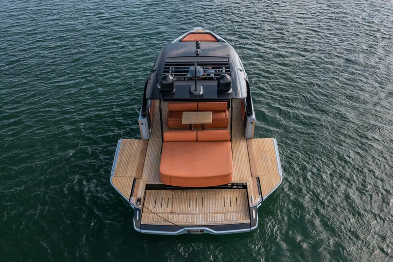 Slide: The Image of 2022 Cranchi A46 Luxury Tender on water, showcasing elegant deck design. - 11