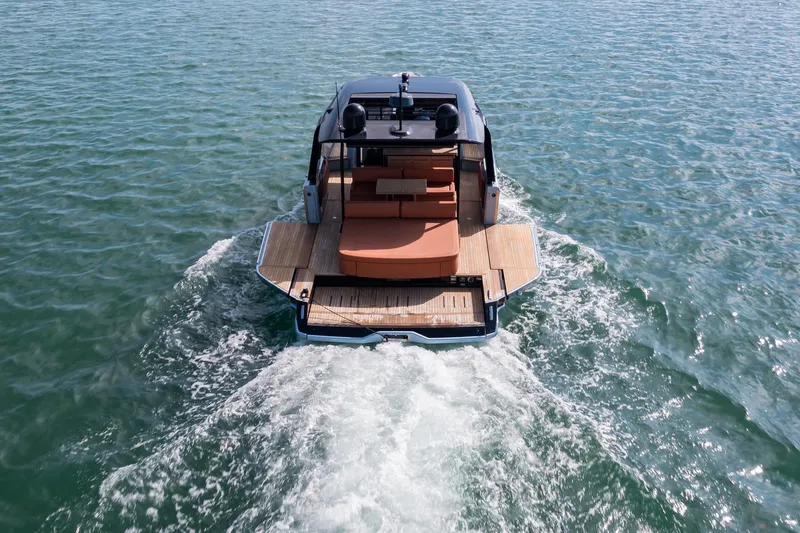 Slide: The Image of 2022 Cranchi A46 Luxury Tender cruising on open water, rear view. - 24