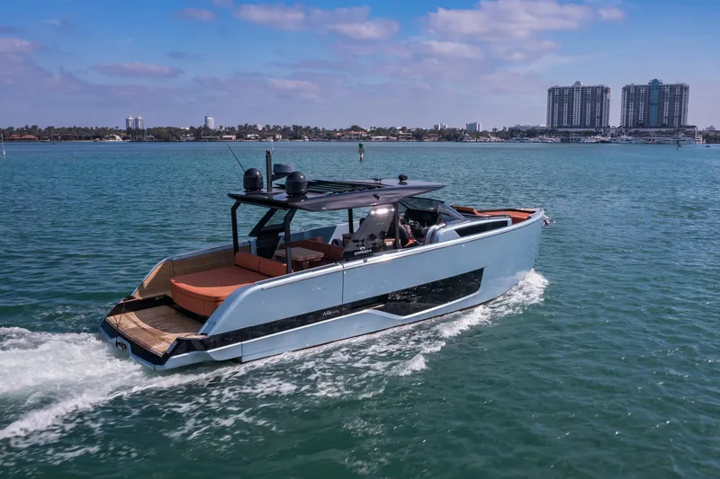 Slide: The Image of 2022 Cranchi A46 Luxury Tender cruising on a sunny day near urban skyline. - 26