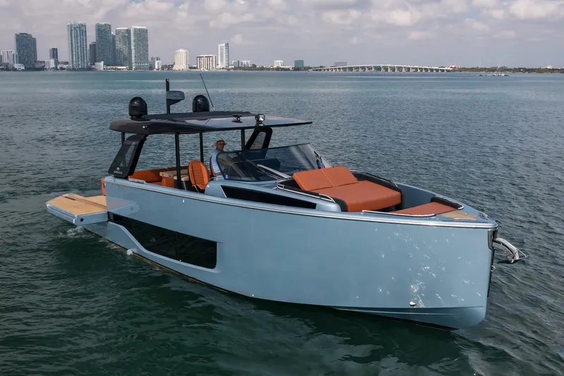 Slide: The Image of 2022 Cranchi A46 Luxury Tender yacht cruising near city skyline. - 3