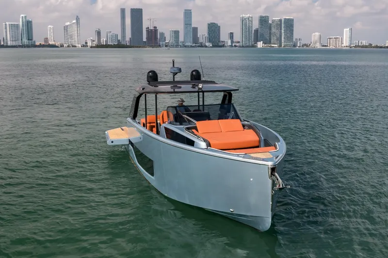 Slide: The Image of 2022 Cranchi A46 Luxury Tender on water with city skyline backdrop. - 4