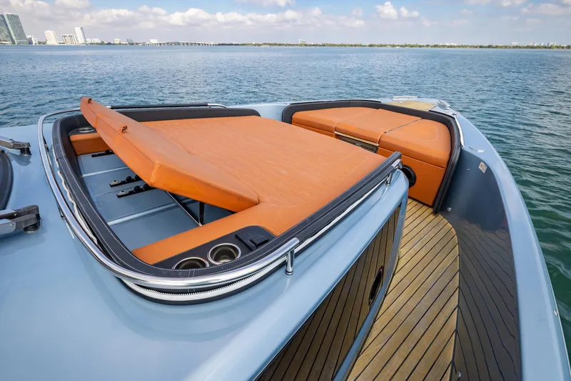 Slide: The Image of 2022 Cranchi A46 Luxury Tender with orange seating, docked on calm waters. - 41