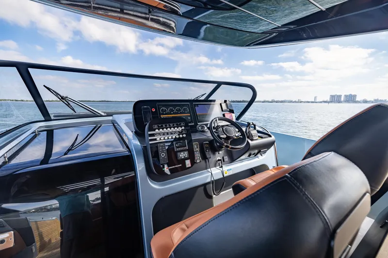 Slide: The Image of 2022 Cranchi A46 Luxury Tender cockpit with modern controls and ocean view. - 47