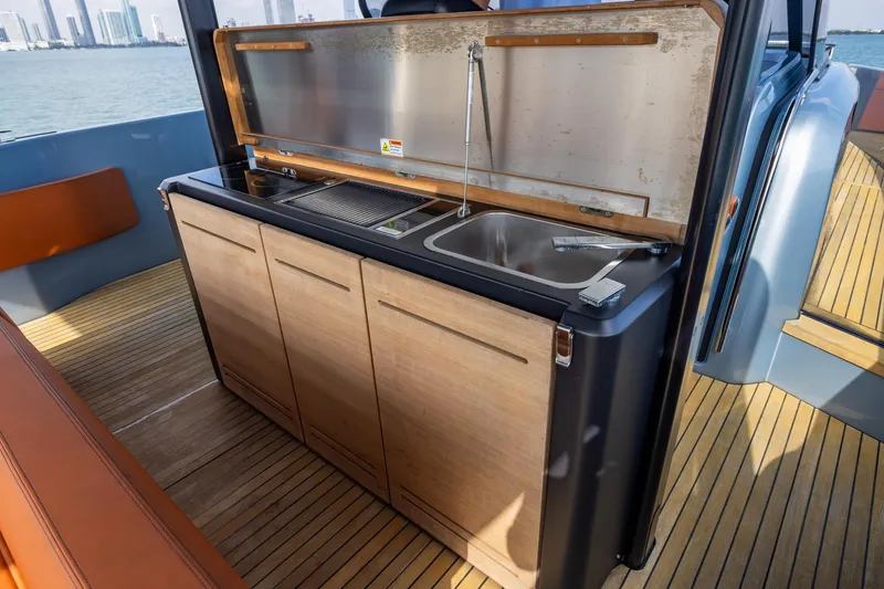 Slide: The Image of Outdoor kitchenette on 2022 Cranchi A46 Luxury Tender yacht with sink and grill. - 49