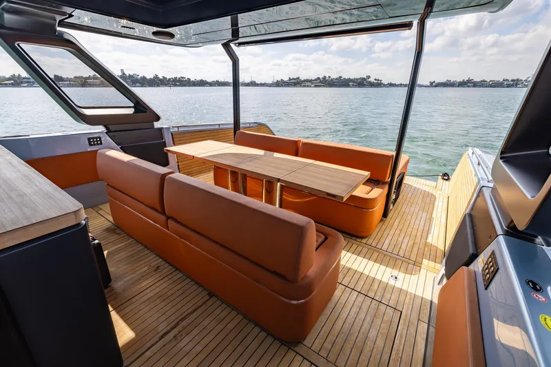 Slide: The Image of Luxurious 2022 Cranchi A46 Tender with elegant seating and scenic water view. - 51