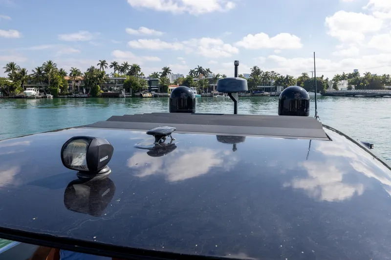 Slide: The Image of Rooftop view of 2022 Cranchi A46 Luxury Tender on a sunny day by the water. - 54