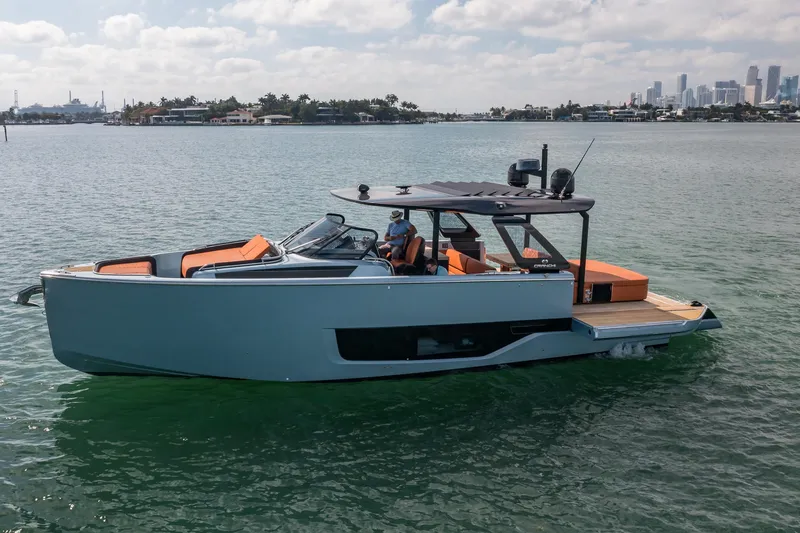 Slide: The Image of 2022 Cranchi A46 Luxury Tender on water, modern design, city skyline background. - 6