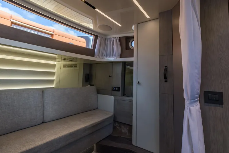 Slide: The Image of Interior of 2022 Cranchi A46 Luxury Tender, featuring modern design and comfortable seating. - 60