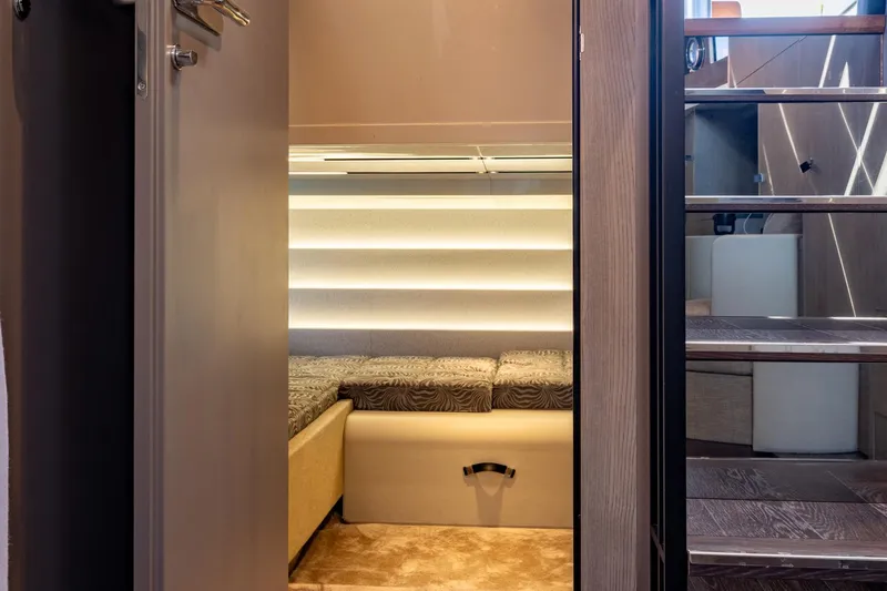 Slide: The Image of Interior of 2022 Cranchi A46 Luxury Tender with modern lighting and wooden stairs. - 63