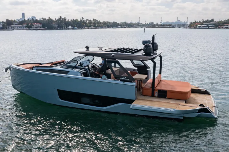 Slide: The Image of 2022 Cranchi A46 Luxury Tender on calm water, showcasing sleek design and modern features. - 7