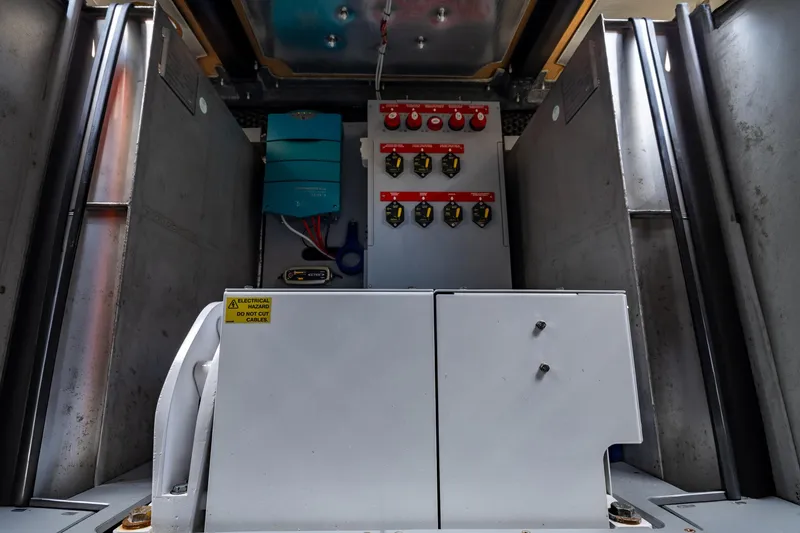 Slide: The Image of Electrical panel inside 2022 Cranchi A46 Luxury Tender yacht, showcasing switches and wiring. - 75